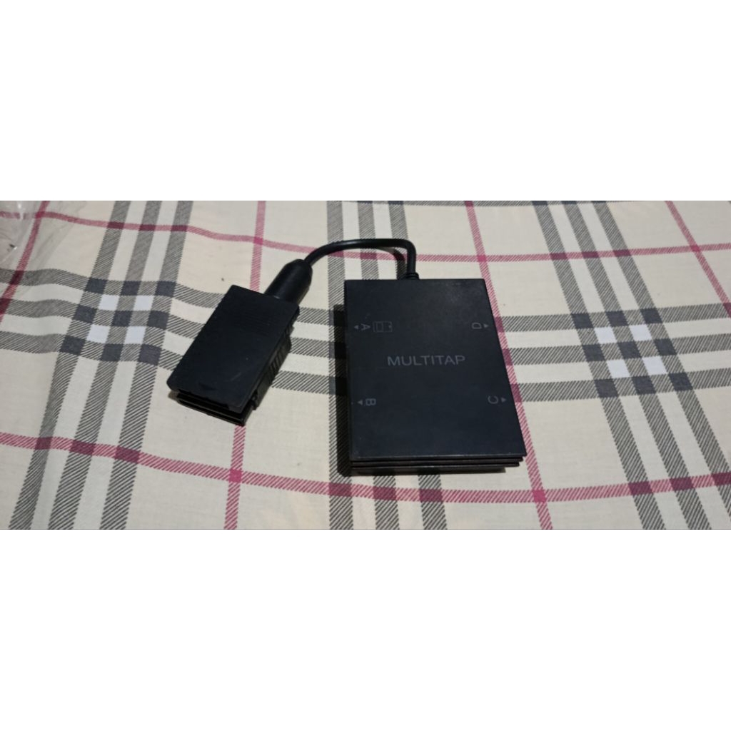 Multitap PS2 untuk main 4 player.