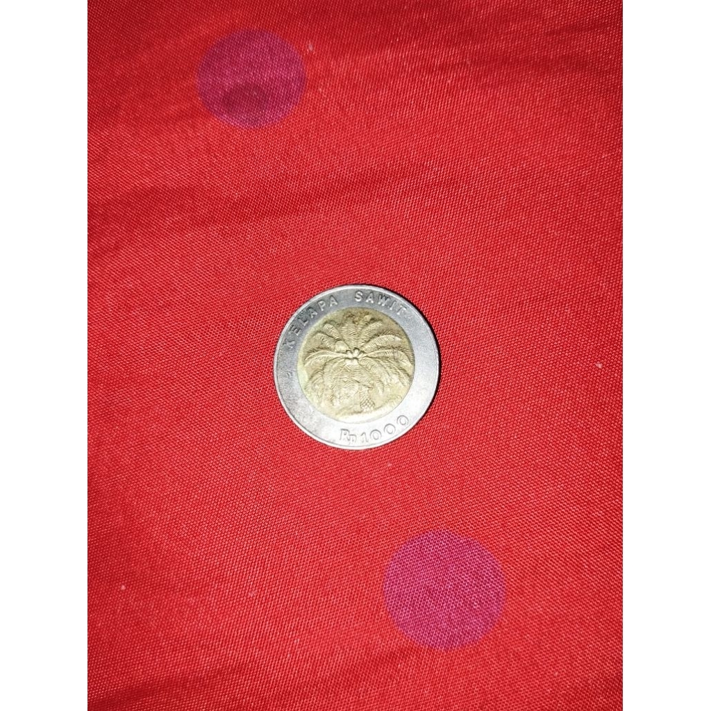 uang seribu kelapa sawit keluaran tahun 2000