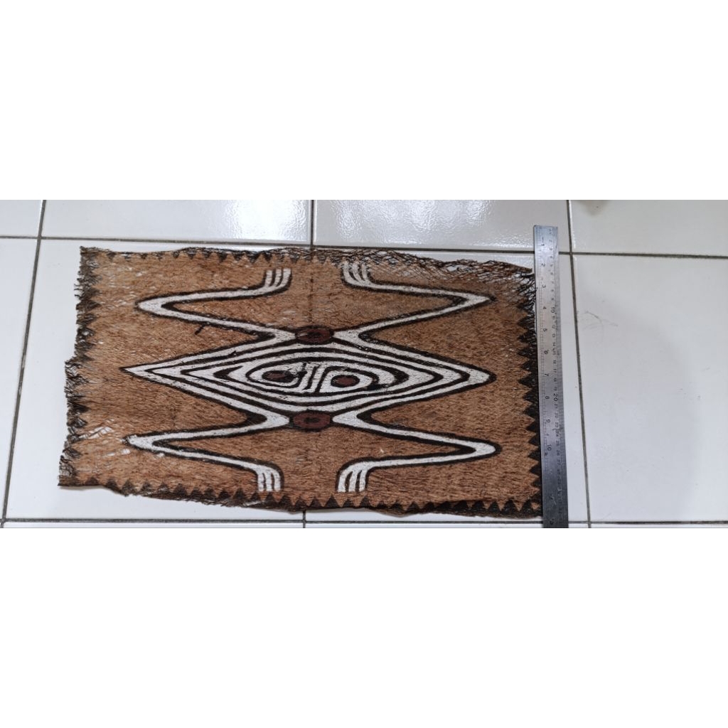 lukisan kayu koteka papua