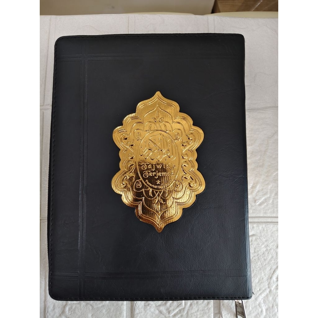 Al-qur'an sampul dompet hitam