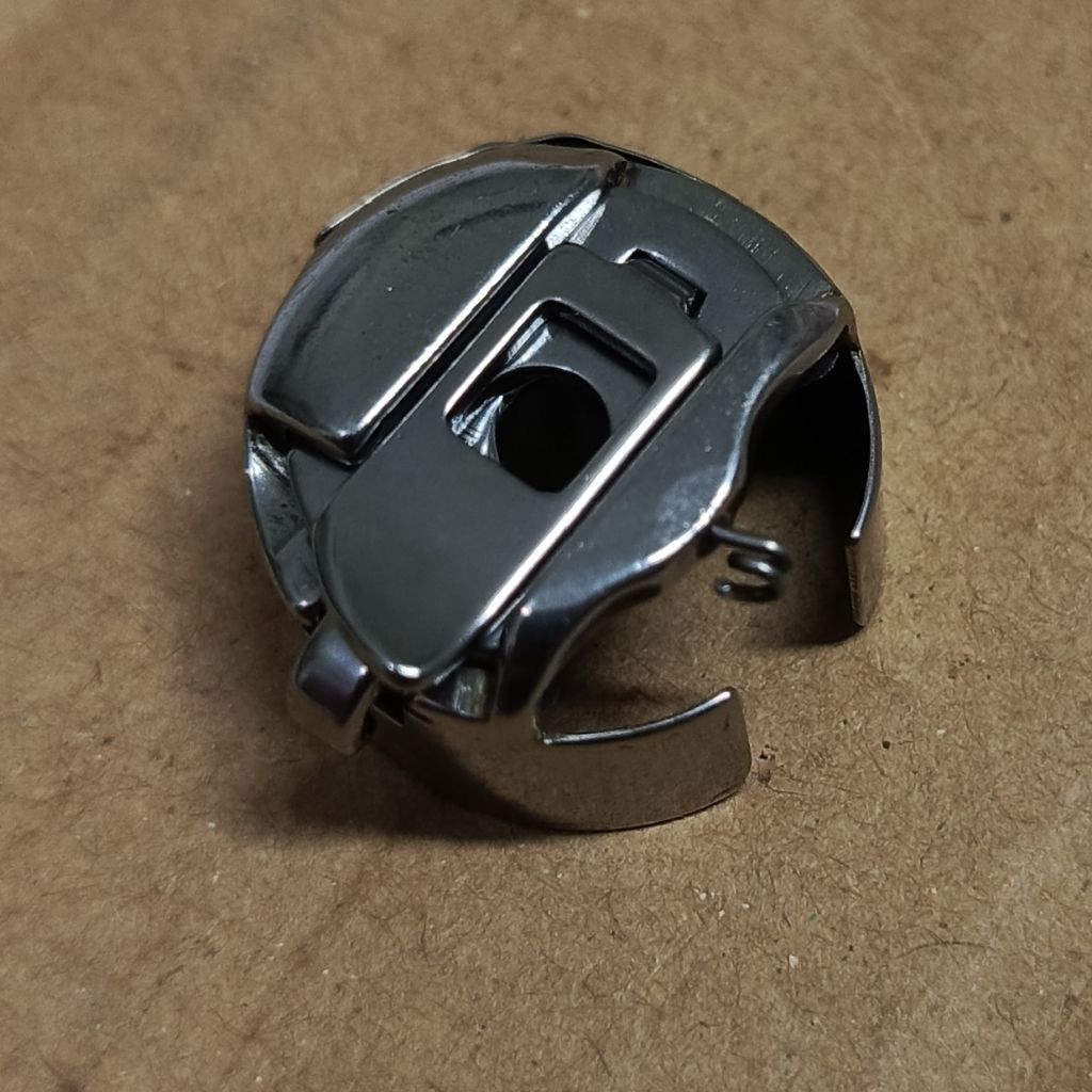 sekoci bobbin case mesin bordir zig-zag pakai per