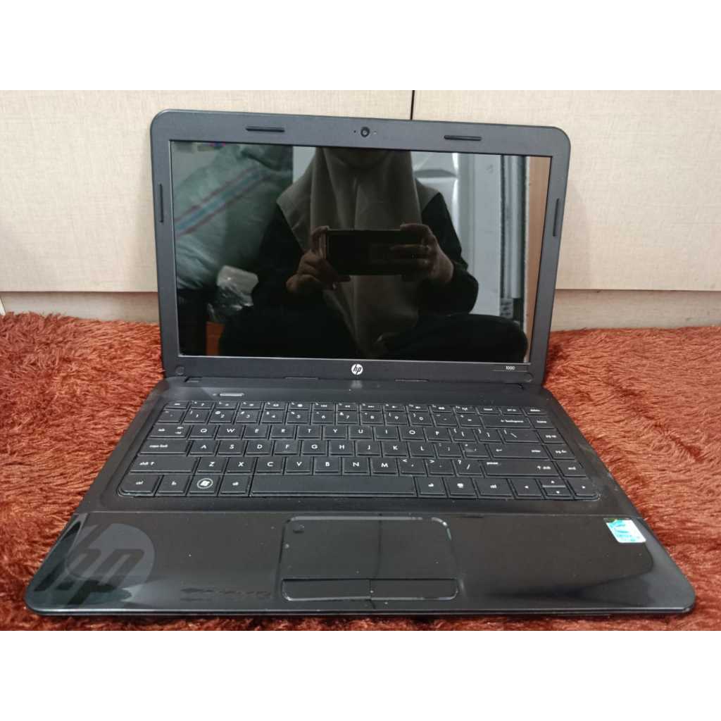 Laptop hp 1000    Windows 7 Ultimate 64-bit   Processor Intel Celeron 1000M 1.8GHz  Ram 4 GB   Penyi