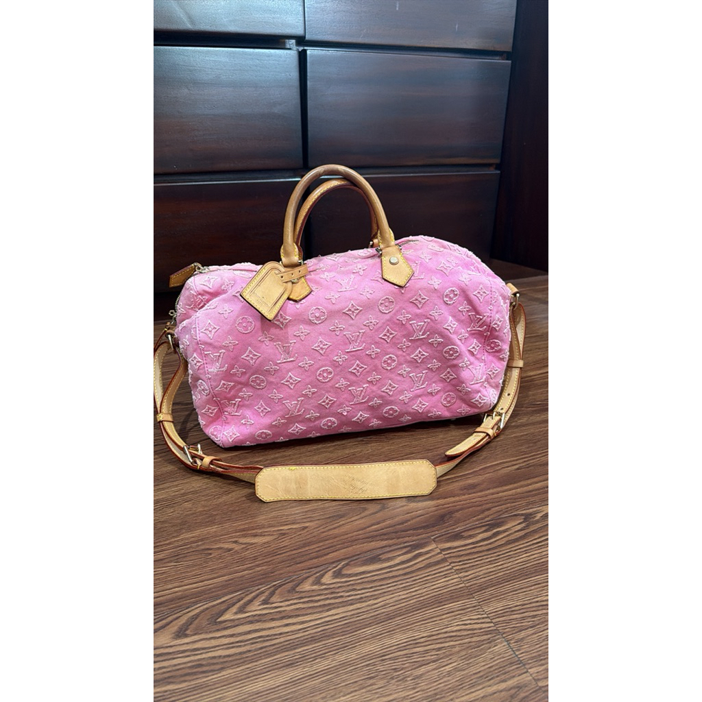 This is a Louis Vuitton Monogram Denim Neo Speedy handbag in pin