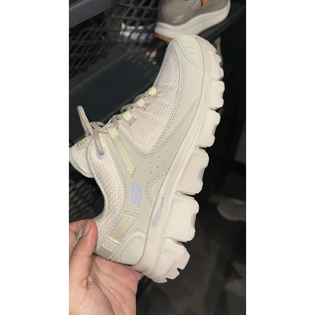 Skechers summits woman