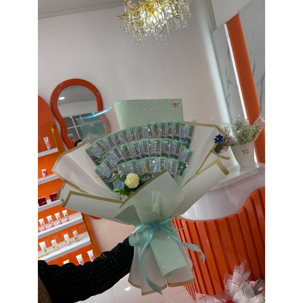 Bouquet uang dan bunga