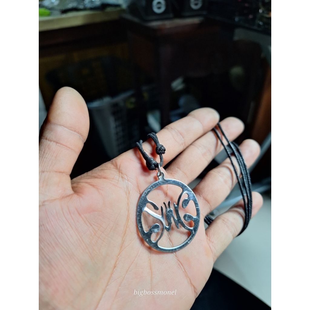 Kalung benang hitam liontin koin slank anti karat baja putih monel original