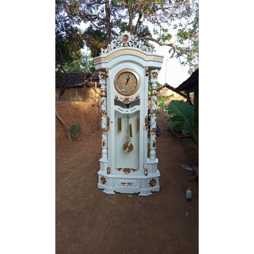 almari jam gadang bandul kayu jati ukir