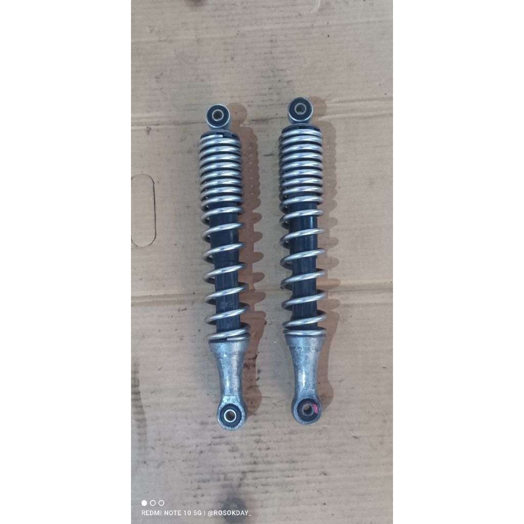 shock belakang karisma