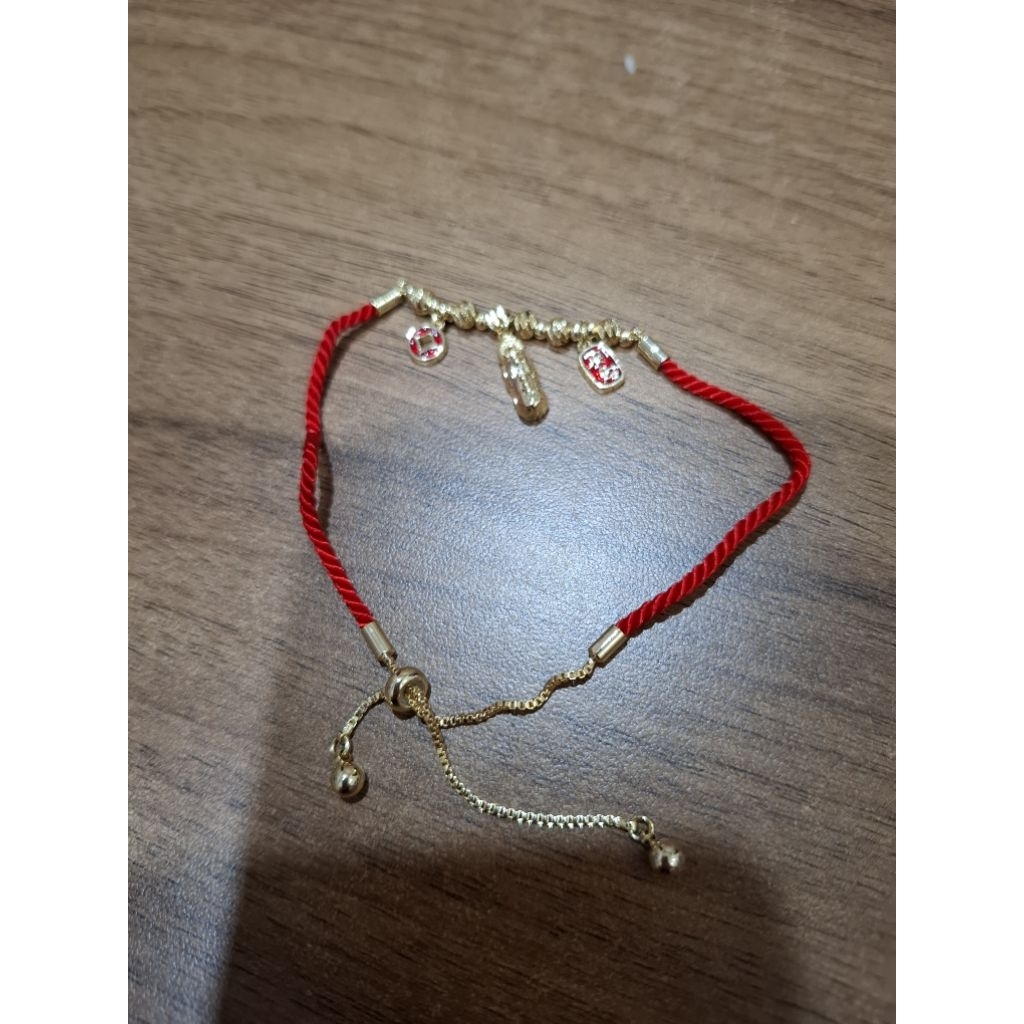 Gelang tali merah lapis emas