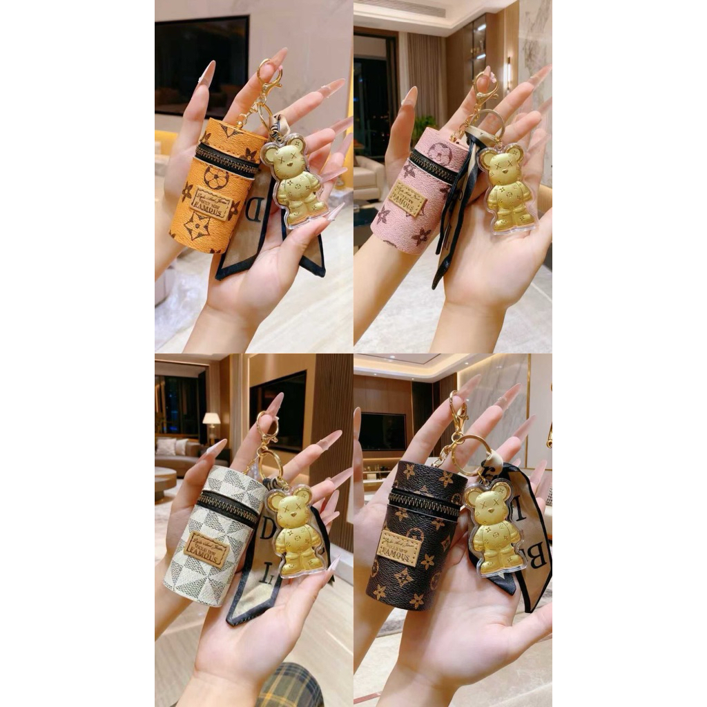 GANCI EMAS / BAG CHARM GOLD KAWS W/DOMPET BULAT LV LIMITED EDITION