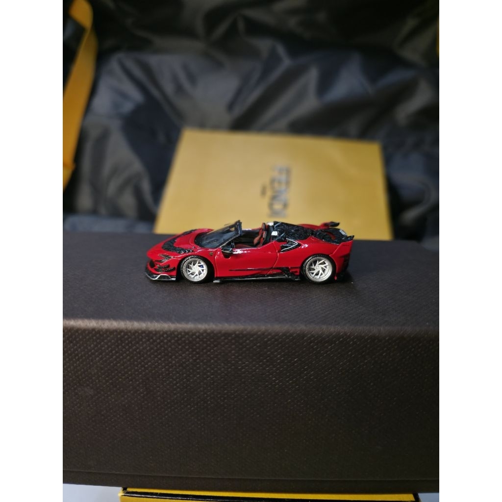 Ferrari Mansory F9XX Red by HKM Premium 1/64. warna red Ferrari dengan aksen carbon fiber. scale 1:6