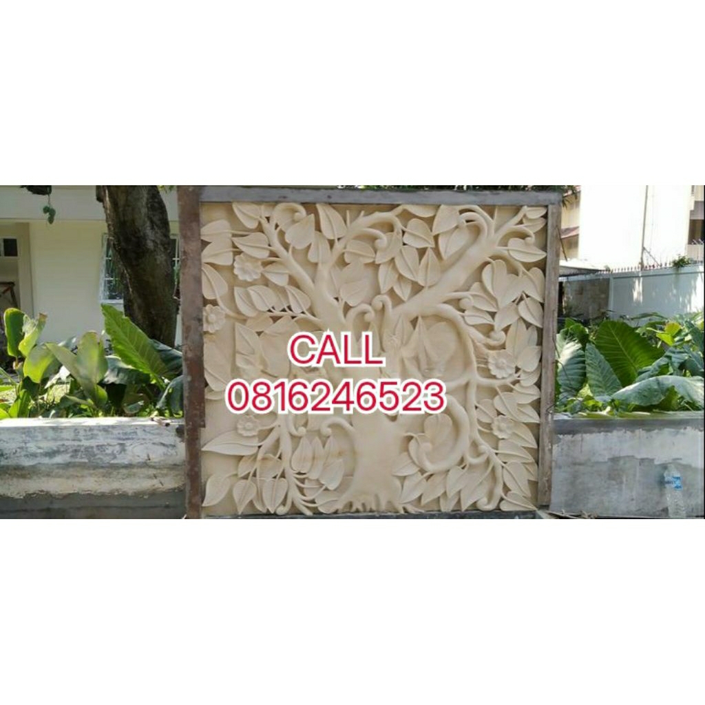 relief bunga batu alam pagar taman ruang tamu