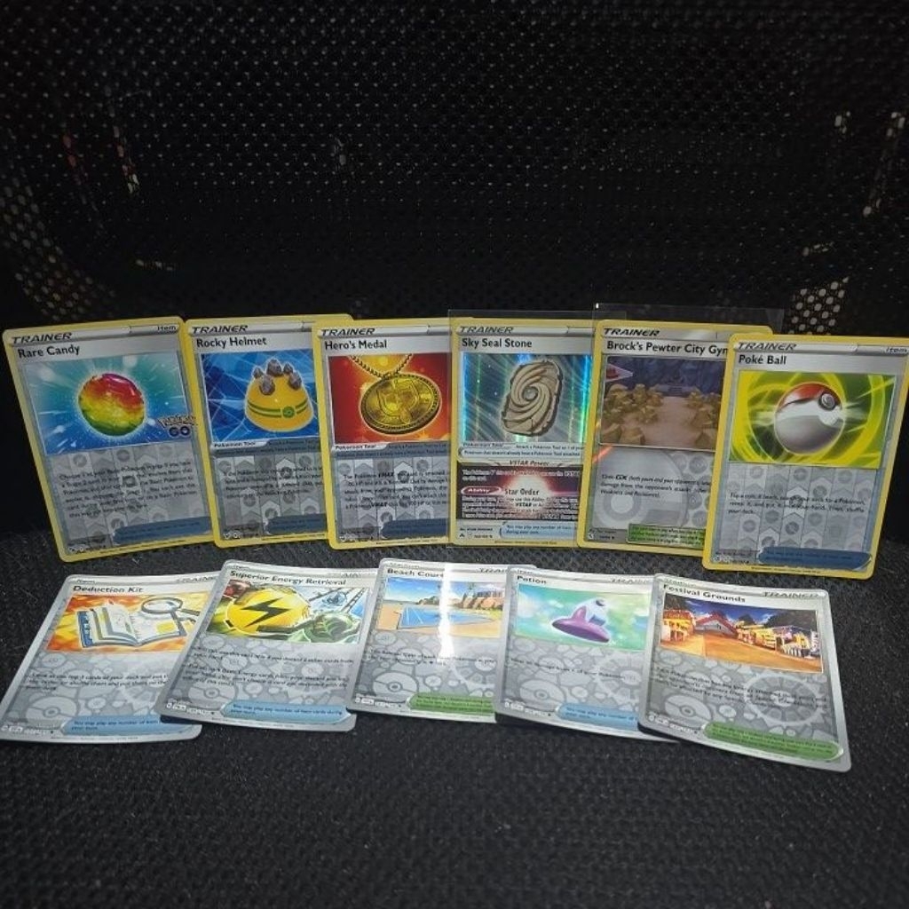 Pokemon TCG English Staple Reverse Holo: rare candy, rocky helmet, hero's medal  sky seal stone, bro