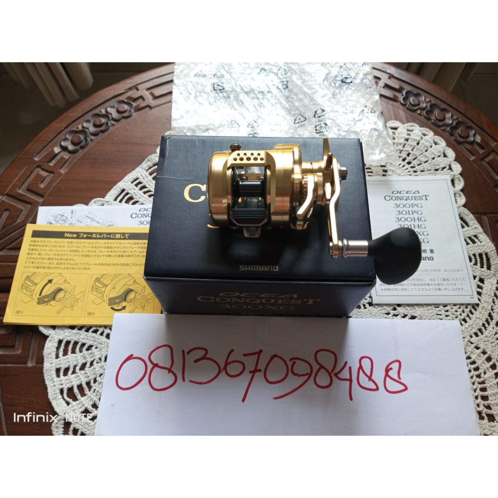 Reel OH Shimano Conquest 300XG Handle Kanan