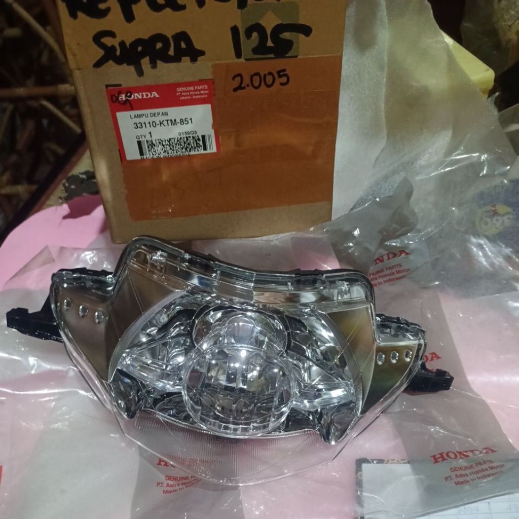 reflektor lampu depan motor Supra 125 original Honda AHM 33110-KTM-851