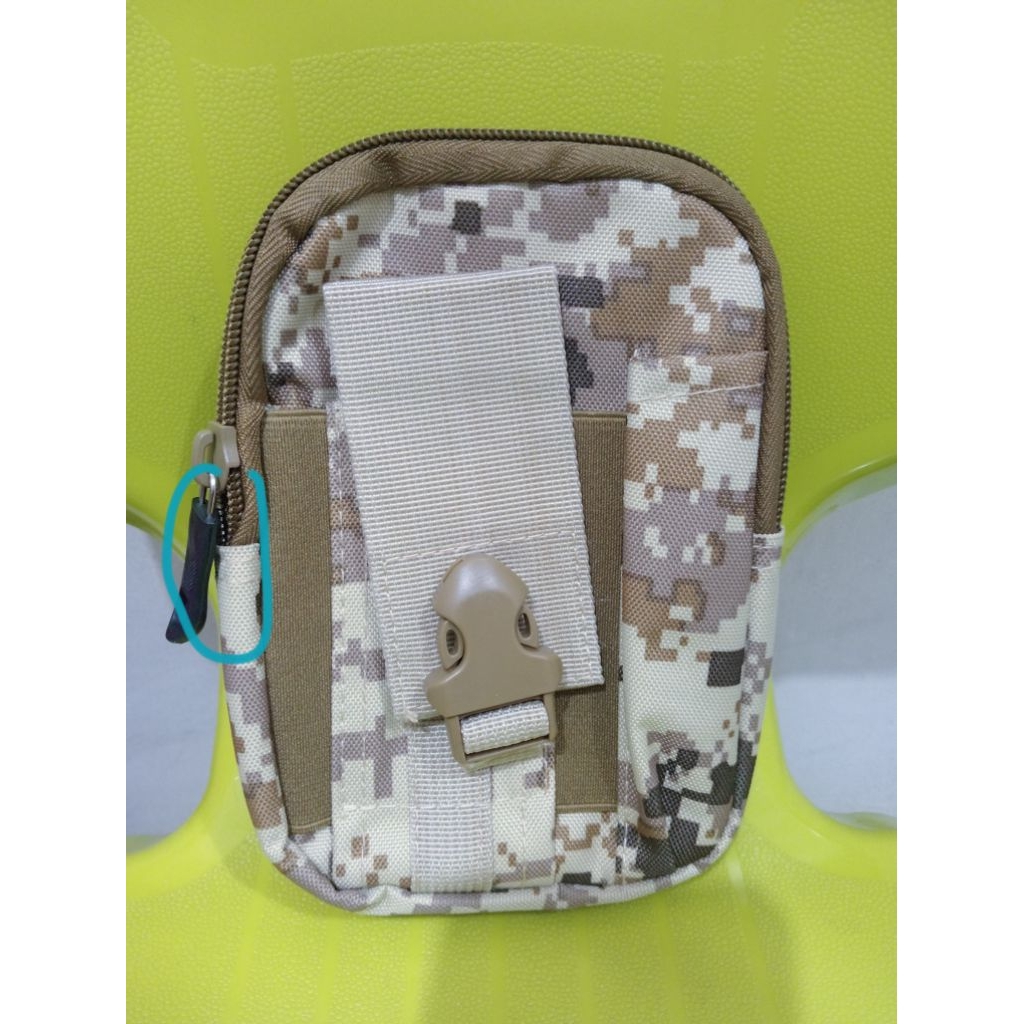 Tujuan: Didesain untuk melindungi dan membawa handphone serta barang-barang kecil lainnya agar tidak