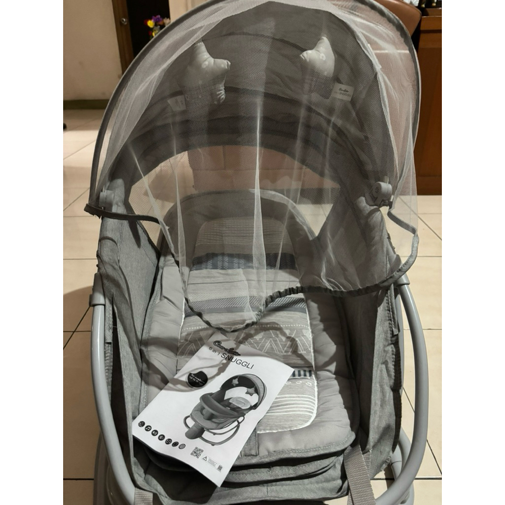 Preloved like new COCOLATTE 6in1 Snuggli Baby Bouncer