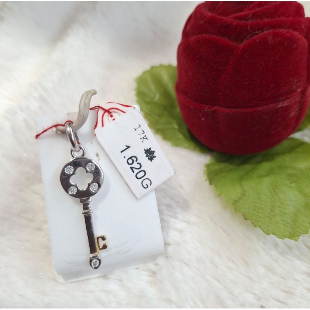 Liontin emas 75 kunci rangka bunga