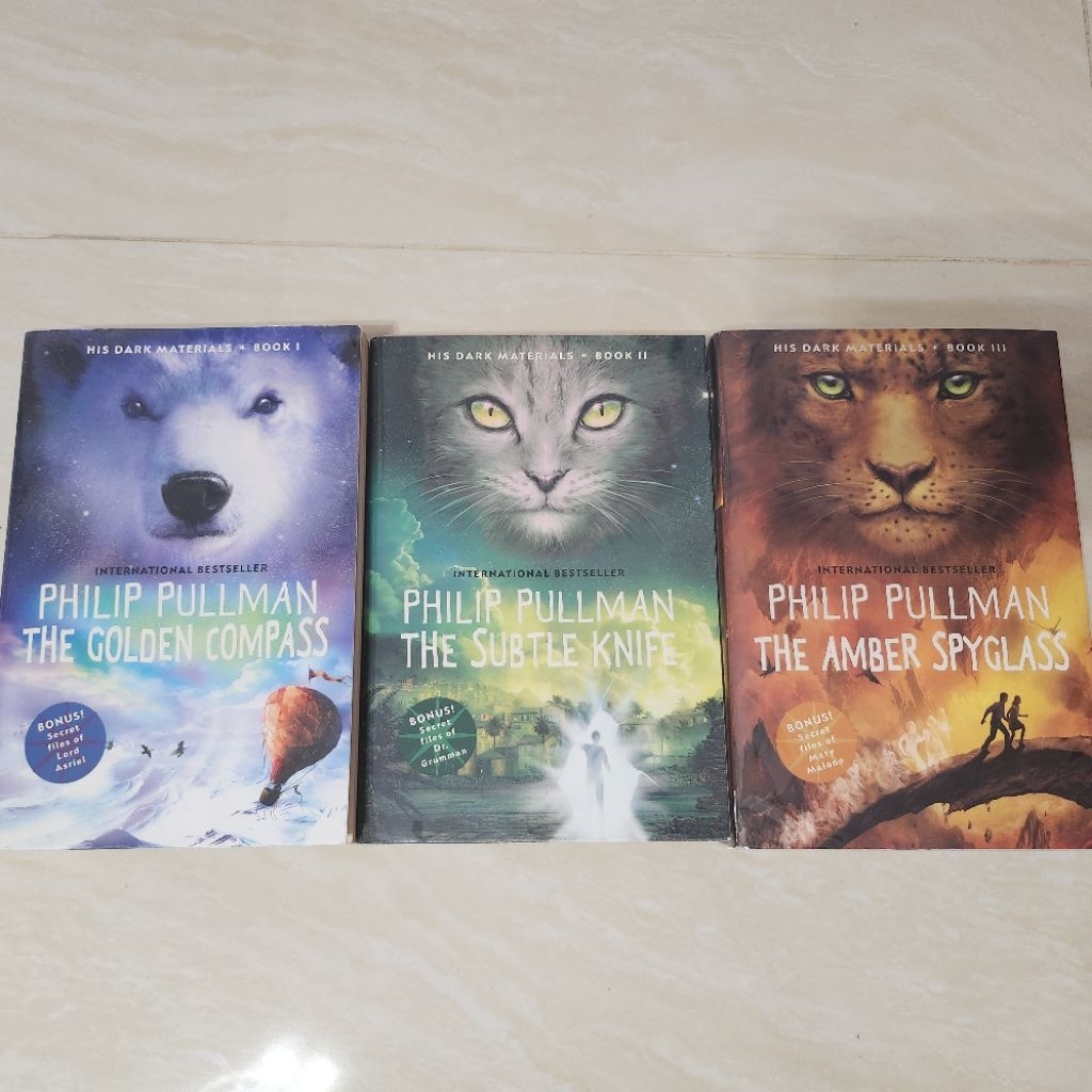 novel import preloved - his dark materials trilogy by phillip pullman - the golden compass trilogy