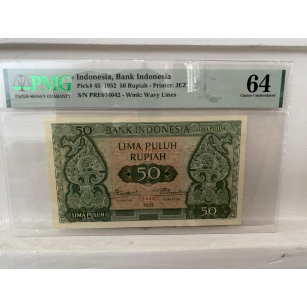 Koleks Uang Kuno Budaya PMG Score 64 Indonesia, Bank Indonesia, 50 Rupiah 1952 - Printer: JEZ