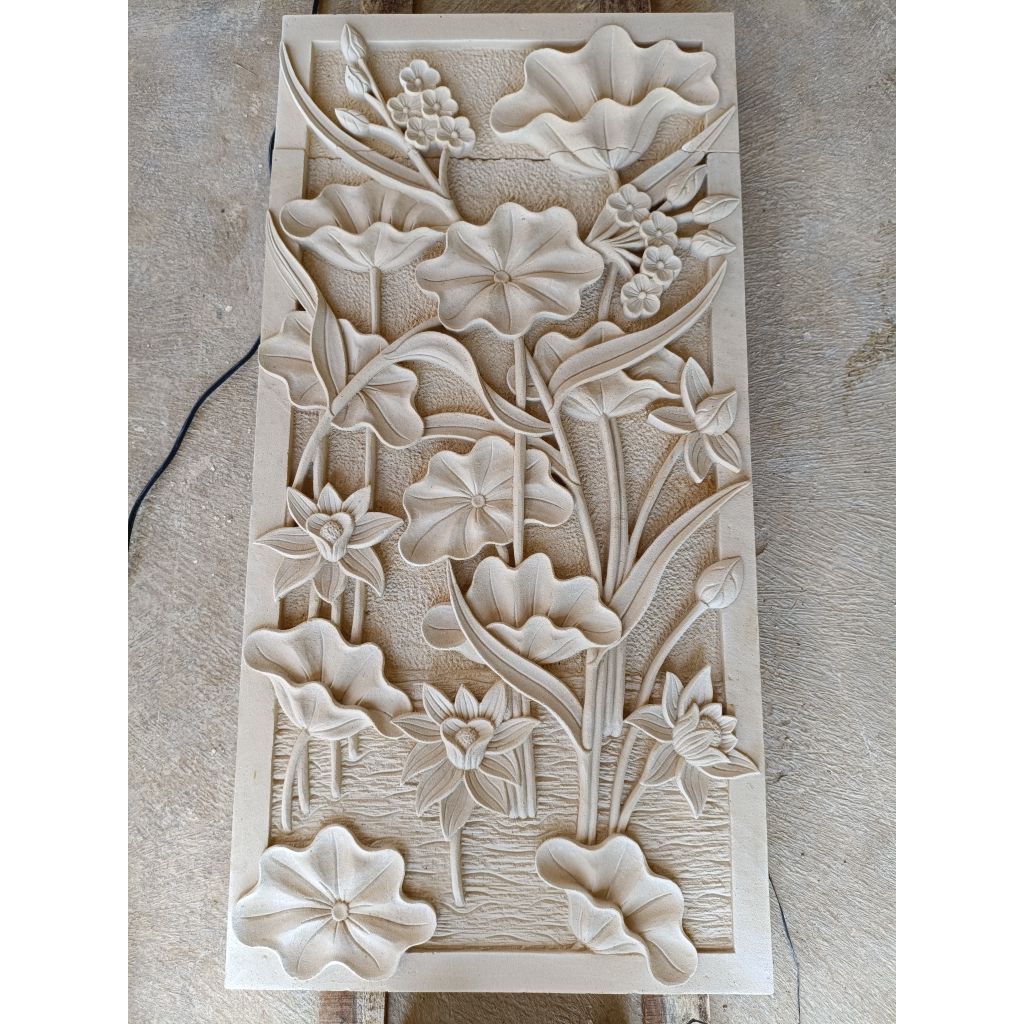 relief ukir batu alam motif bunga teratai