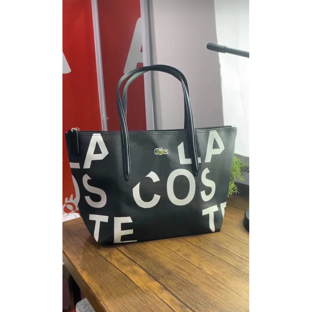 preloved tas biru zipper lacoste