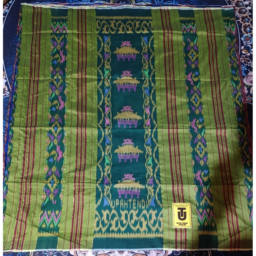 Sarung Upah Tendi Rumah Adat