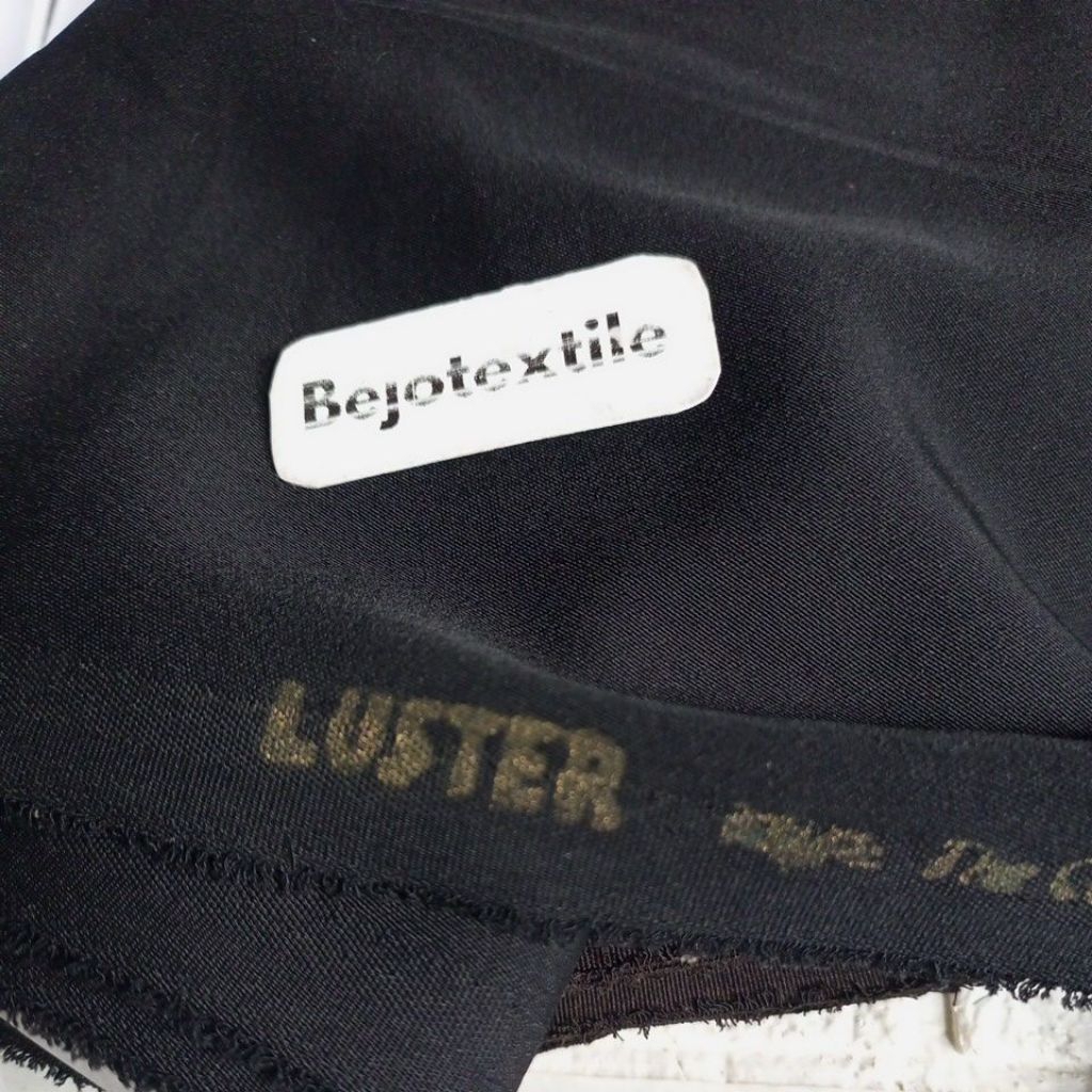 kain celana hitam  luster polos