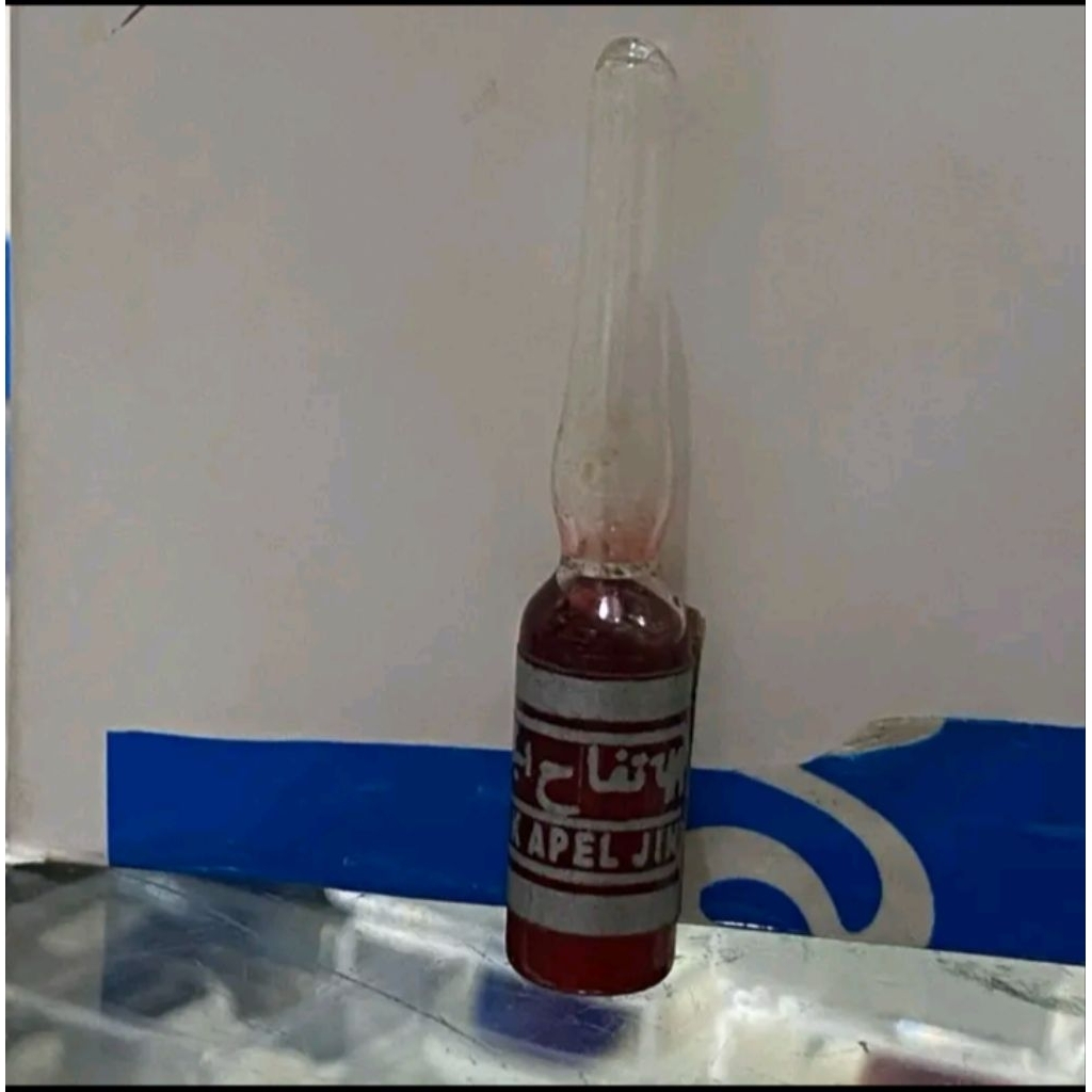 Minyak apel jin turki merah
