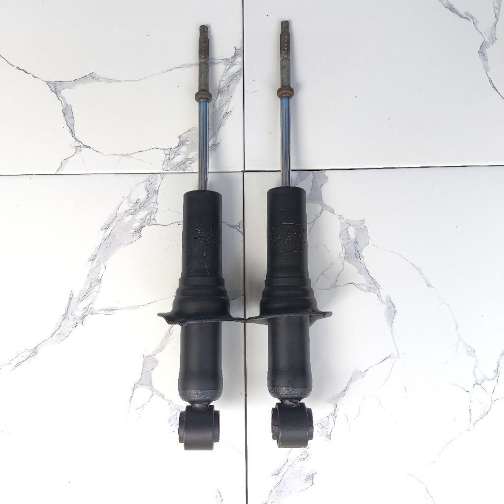 shock nissan navara d40 depan