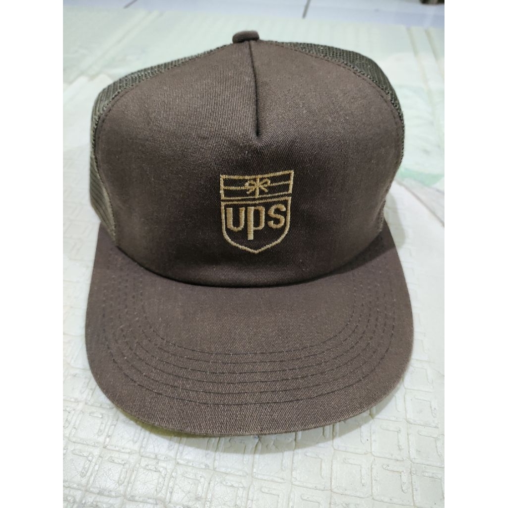 K-product topi lawas UPS strap embos k-product
