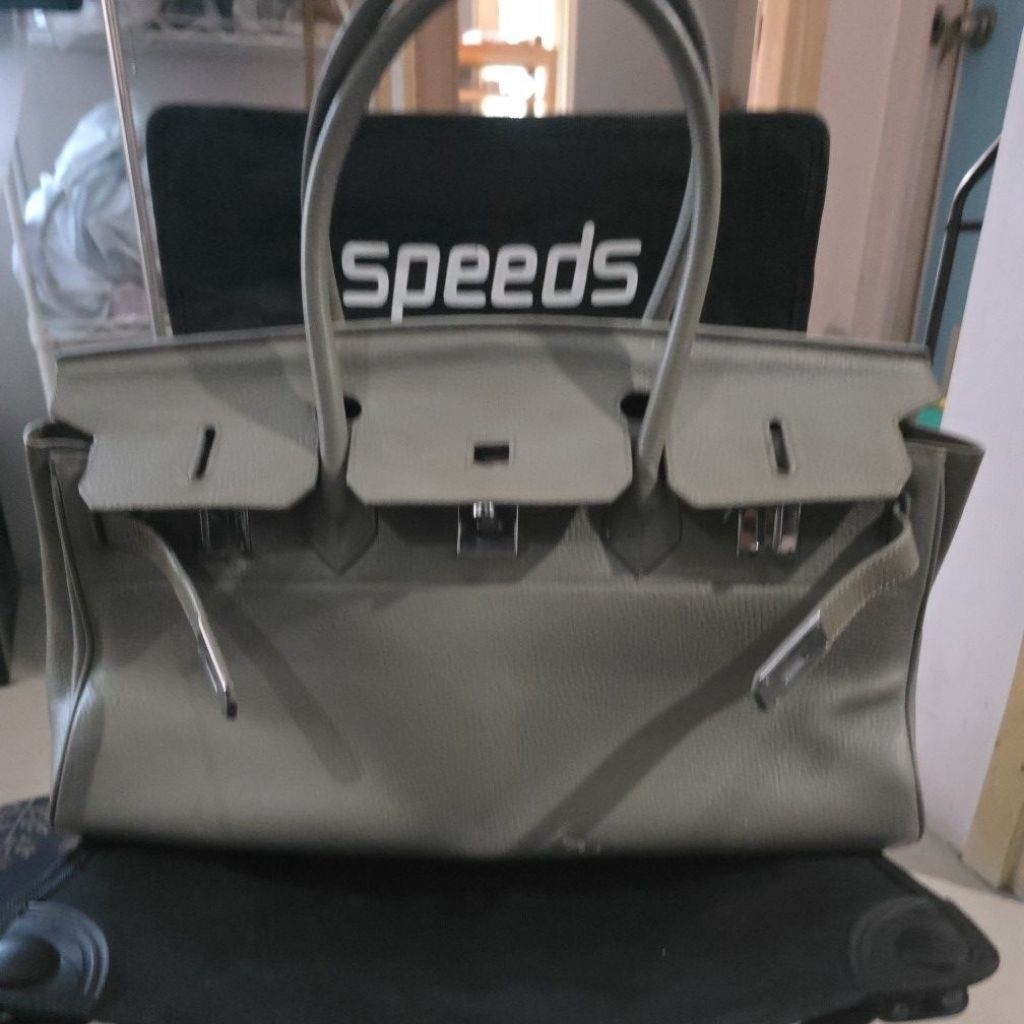 Tas kremes Kelly Panjang Zipper Riri