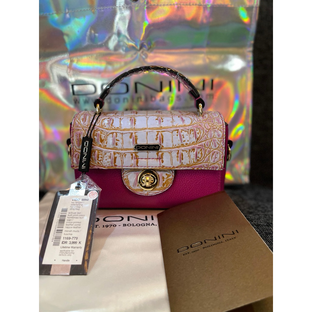 tas donini vigo mini fuscia likenew