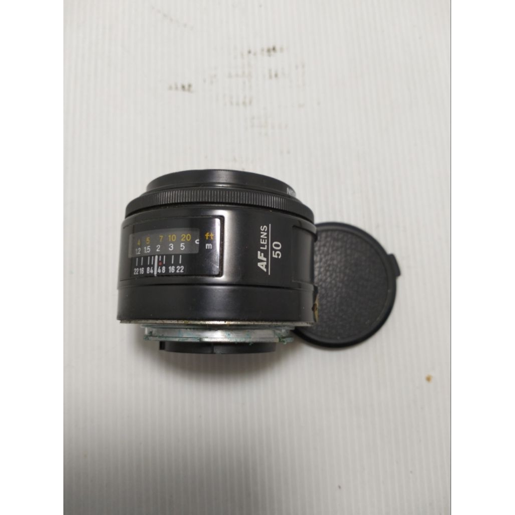 Lensa Minolta 7000 AF 50 mm ,Minolta AF Lens 50 itu artinya focal length-nya 50mm.
