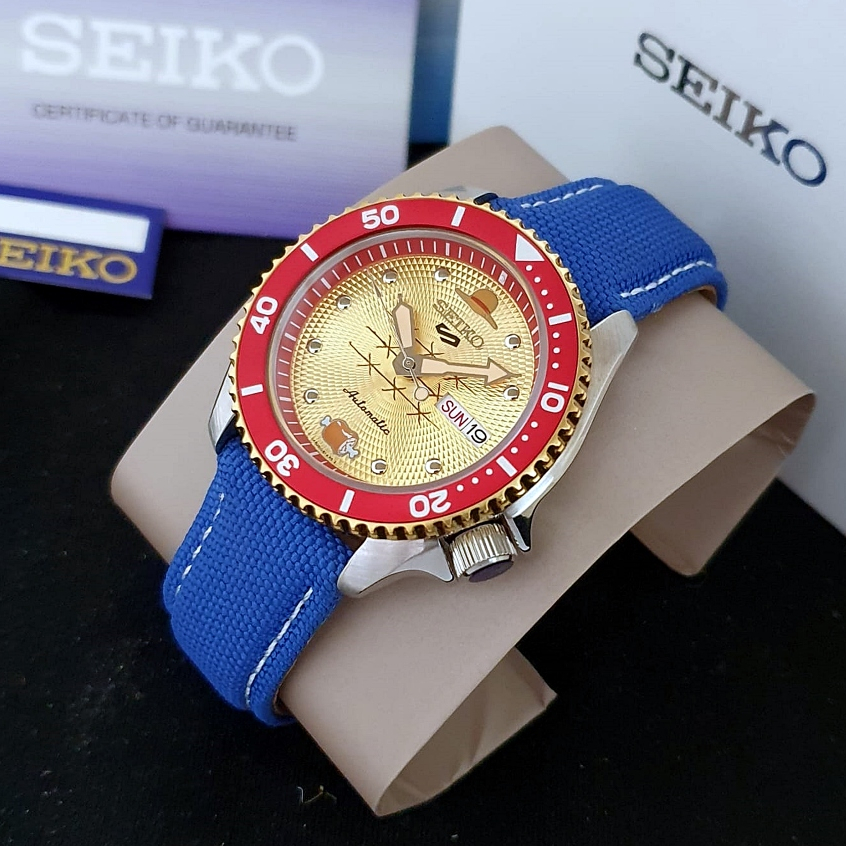 Jam Tangan Pria SEIKO 5 Sports SRPF60K1 x ONE PIECE "Monkey D Luffy" Gold Dial Silver Canvas Special
