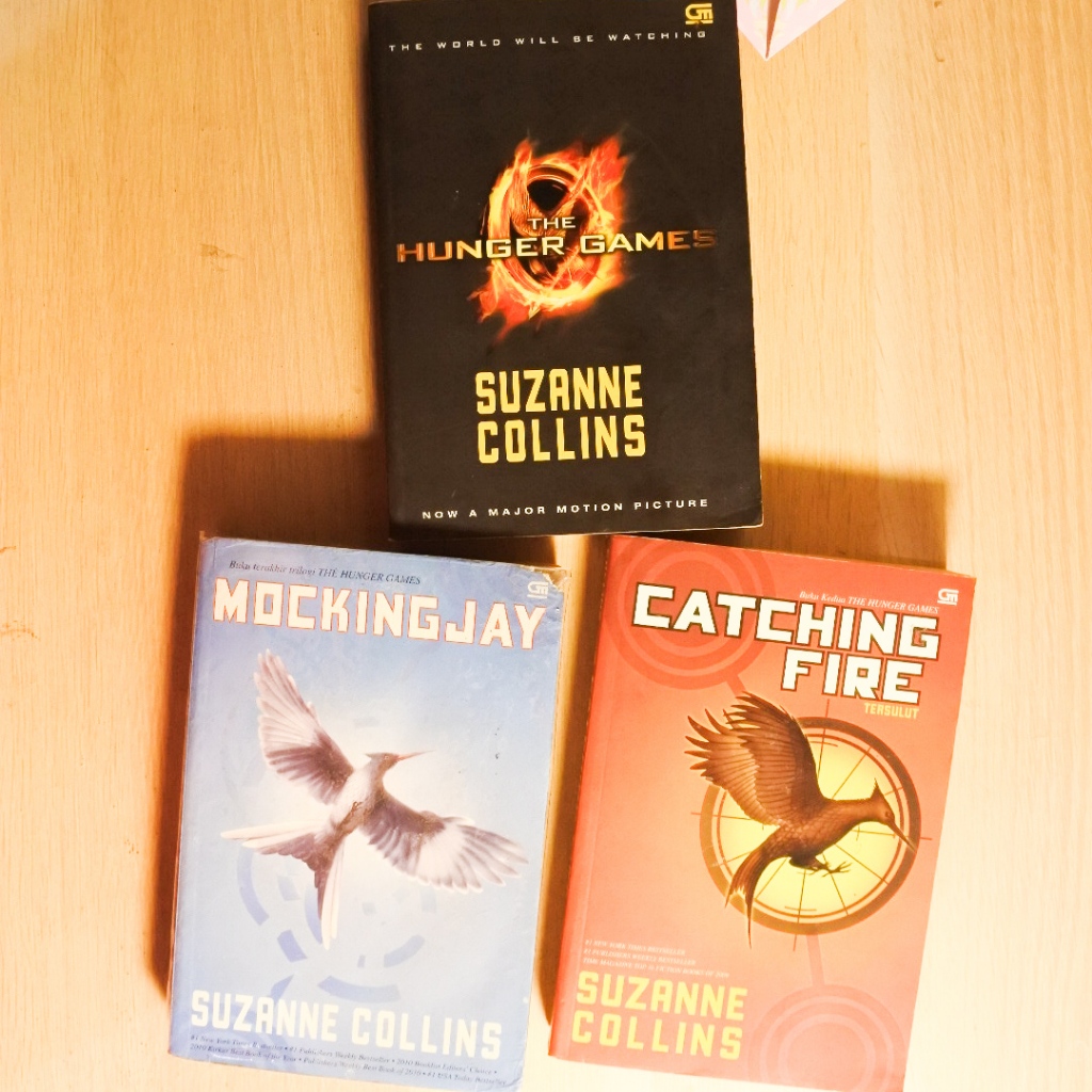 Preloved The Hunger Games Trilogy by Suzanne Collins | The Hunger Games | Catching Fire | Mockingjay