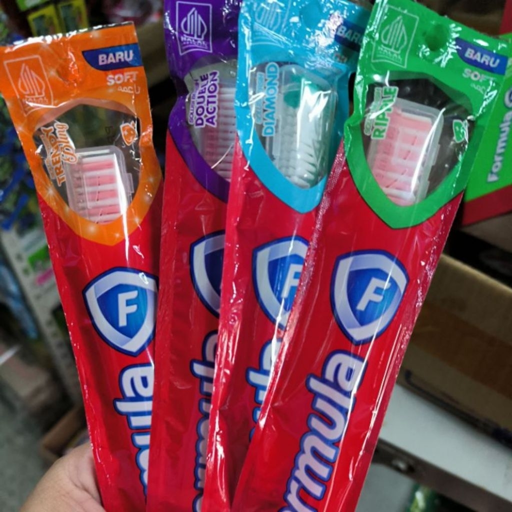 Sikat gigi formula double action