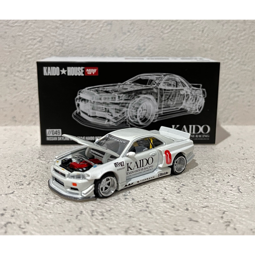 [049] [NON SEGEL/UNSEALED] MINI GT KAIDO HOUSE NISSAN SKYLINE GT-R (R34) KAIDO WORKS PUTIH