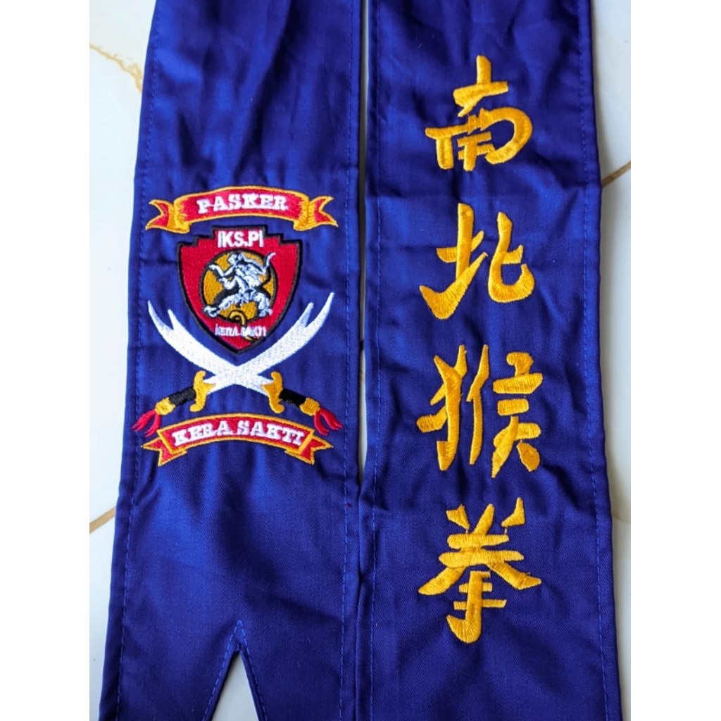 sabuk ikspi kera sakti biru bahan drill kain lembut bordir rapi komputer