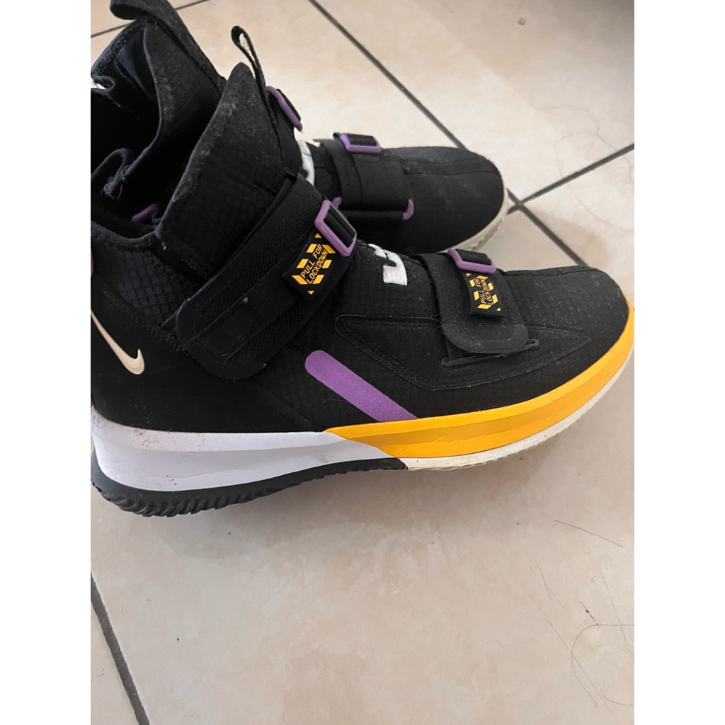 Nike LeBron Soldier 13 SFG basketball shoe in a black, white, purple, and gold (Lakers) colorway