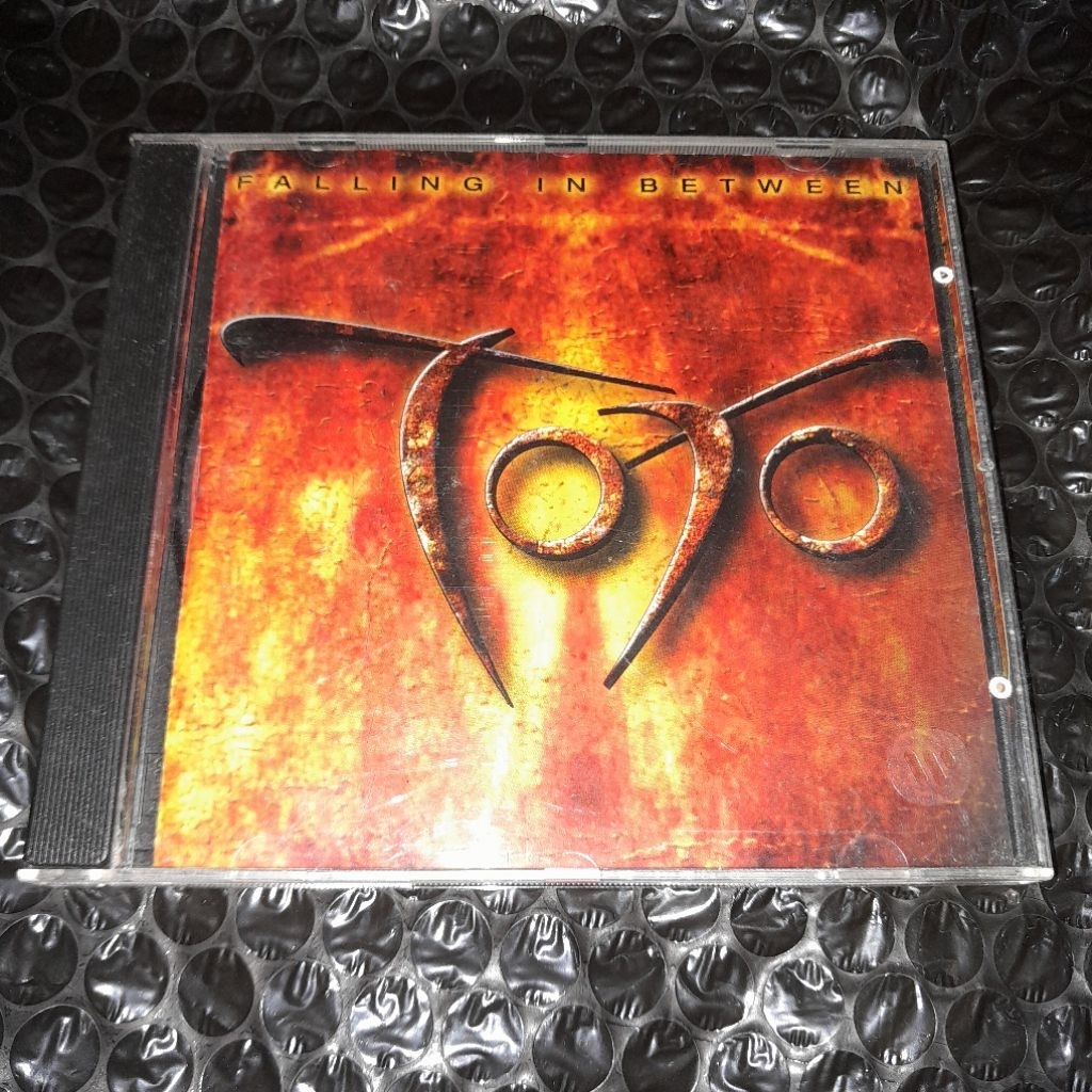 cd TOTO falling in between