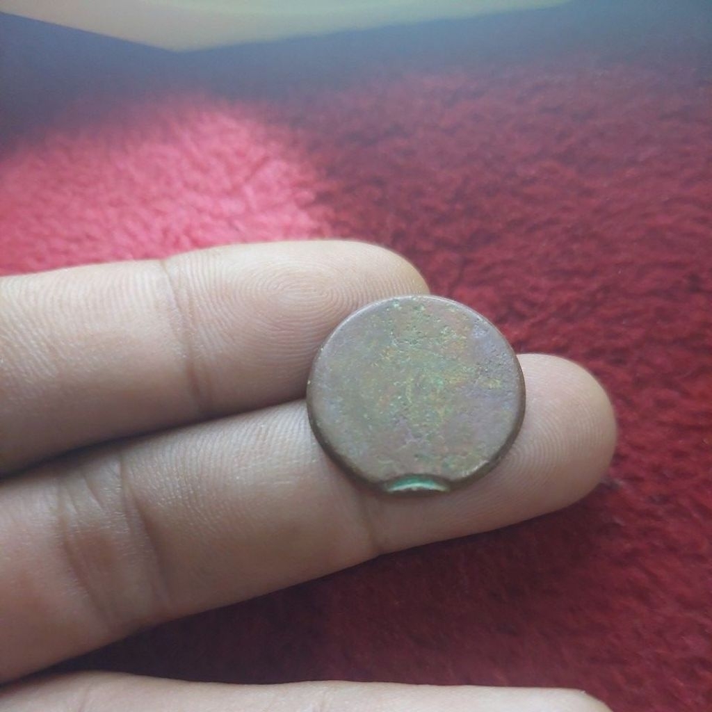 Koin tembaga eror unlisted berat 3,3 gram.