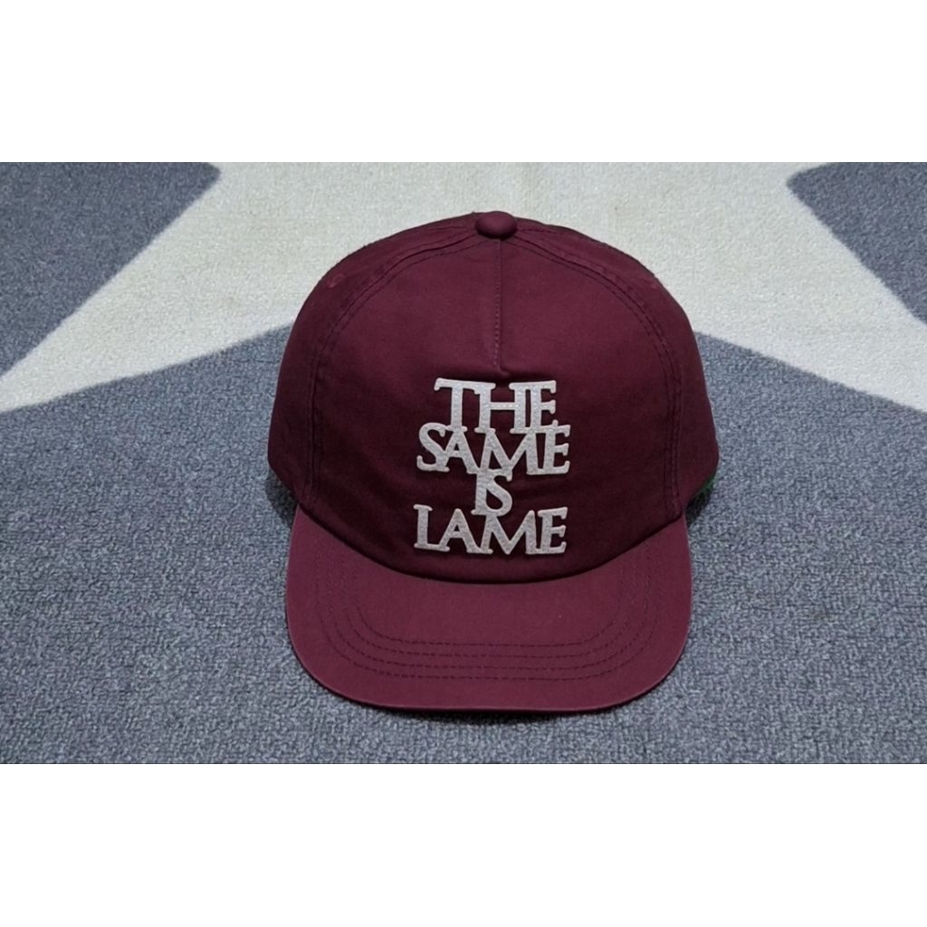 topi merah maroon uniqlo strap kulit original bekas preloved