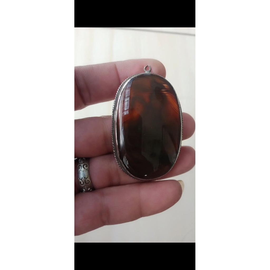 liontin perak batu motif