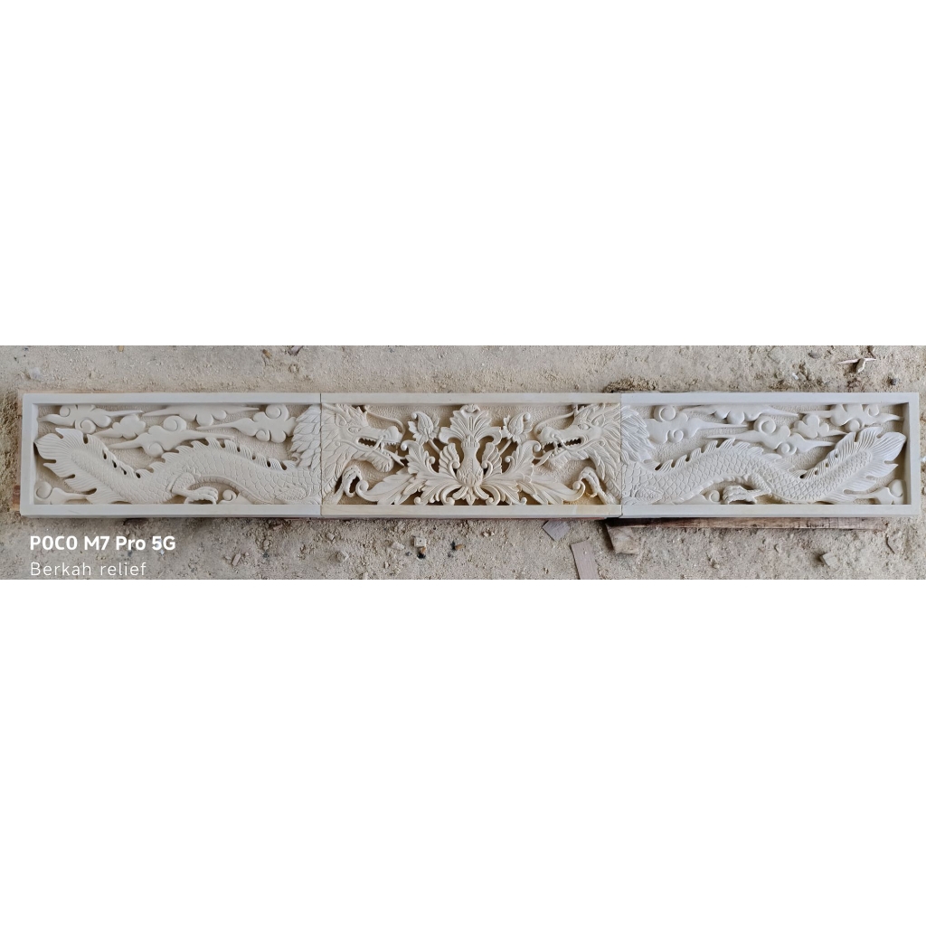 relief ukir batu alam motif naga