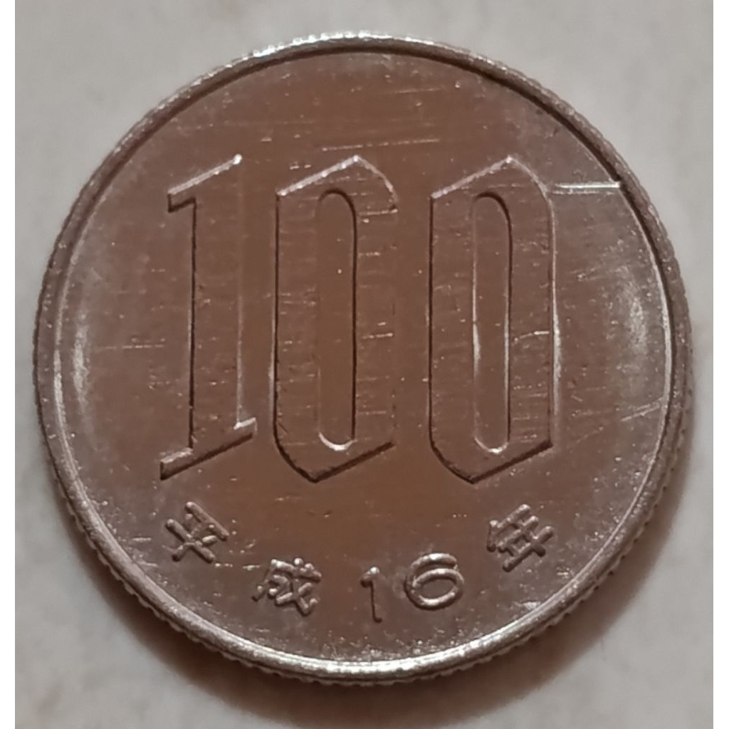 koin Jepang 100 yen tahun 2004..