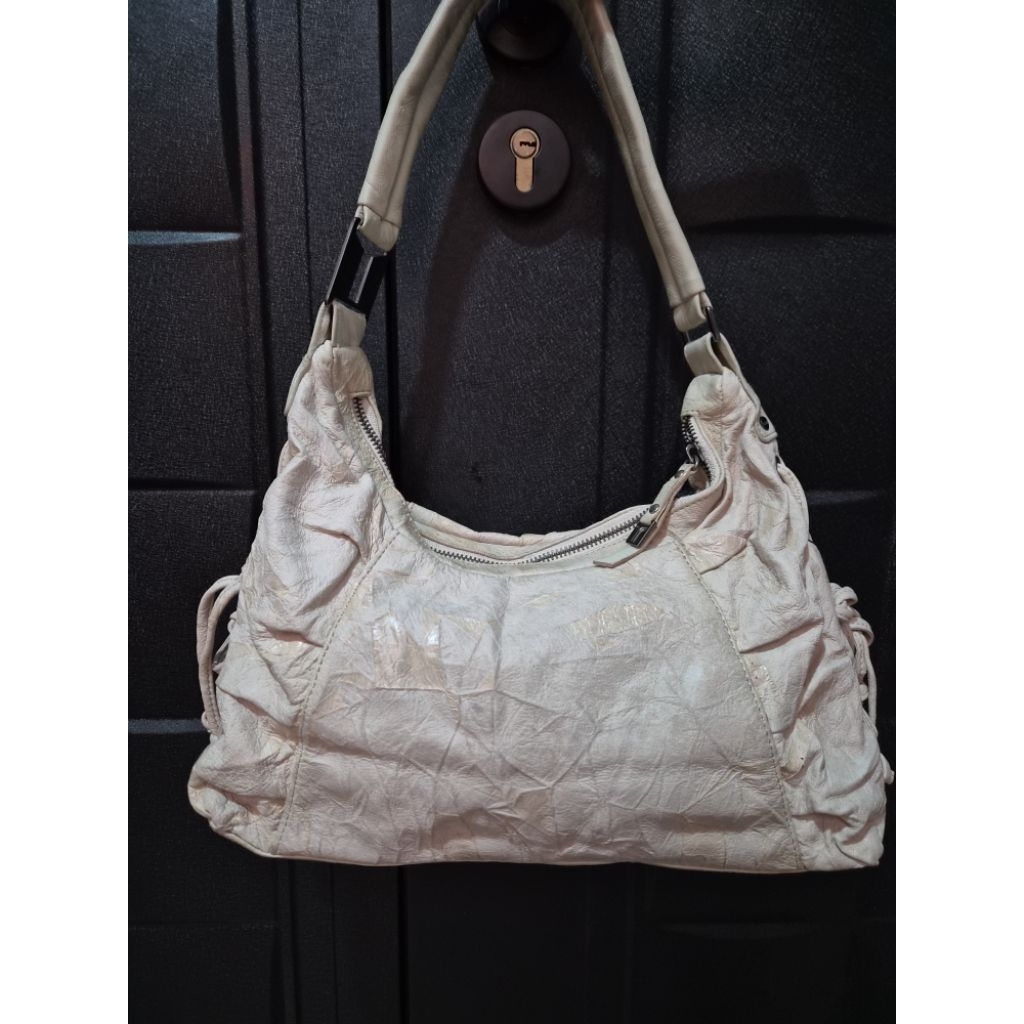 Tas kulit motif Tomboy Wiz