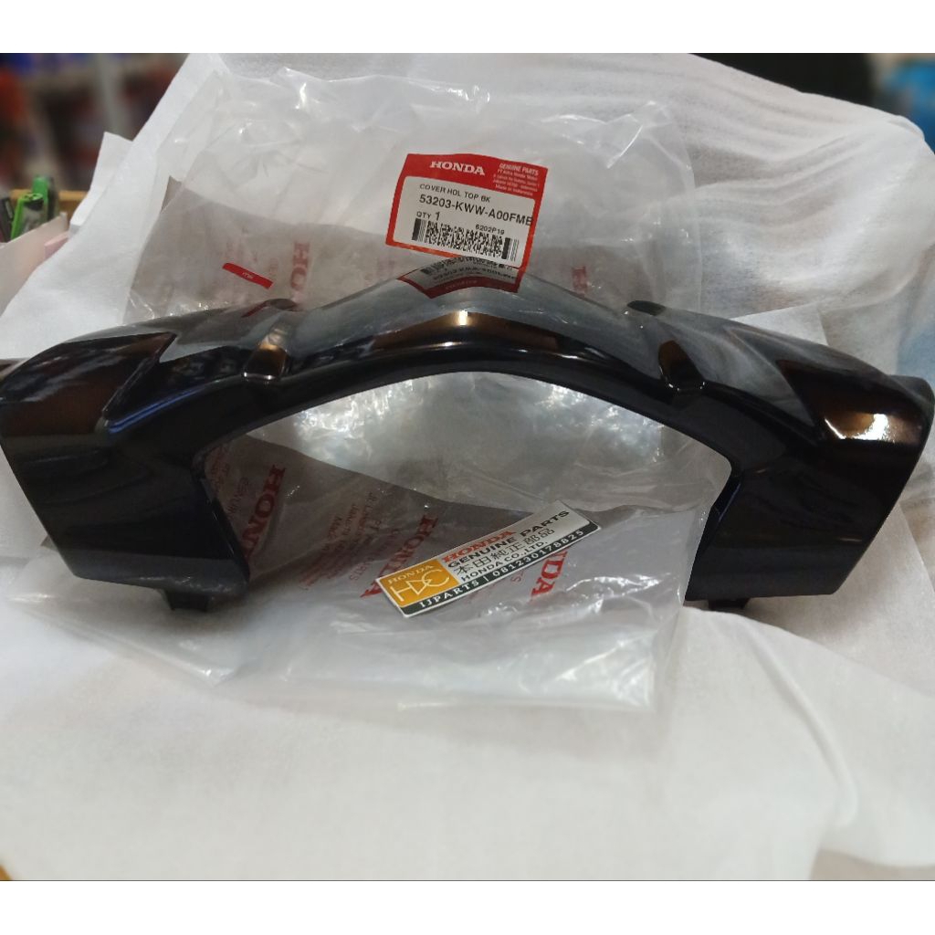 BATOK LAMPU DEPAN REVO ABSOLUTE 110 HITAM BAGIAN ATAS ORIGINAL AHM