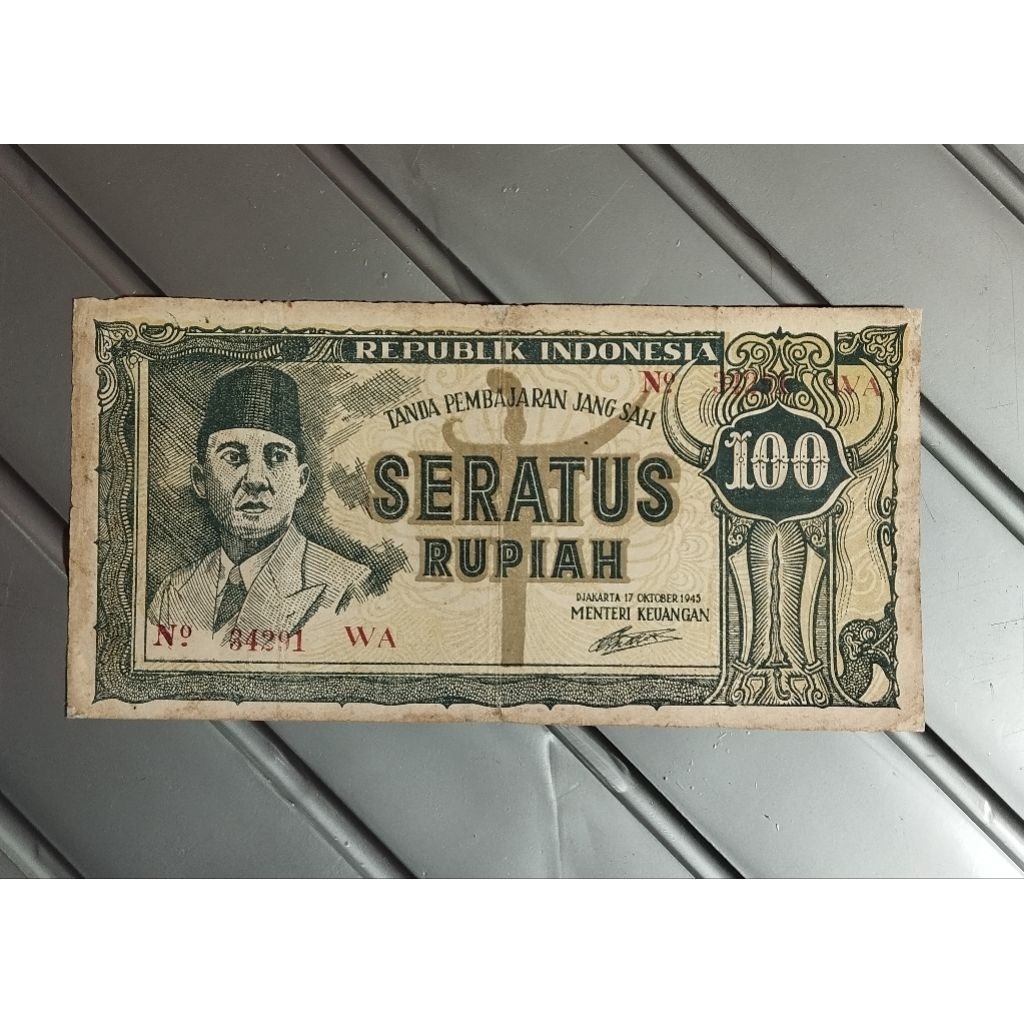 100 rupiah ori thn 1945 bekas beredar  original sesuai foto