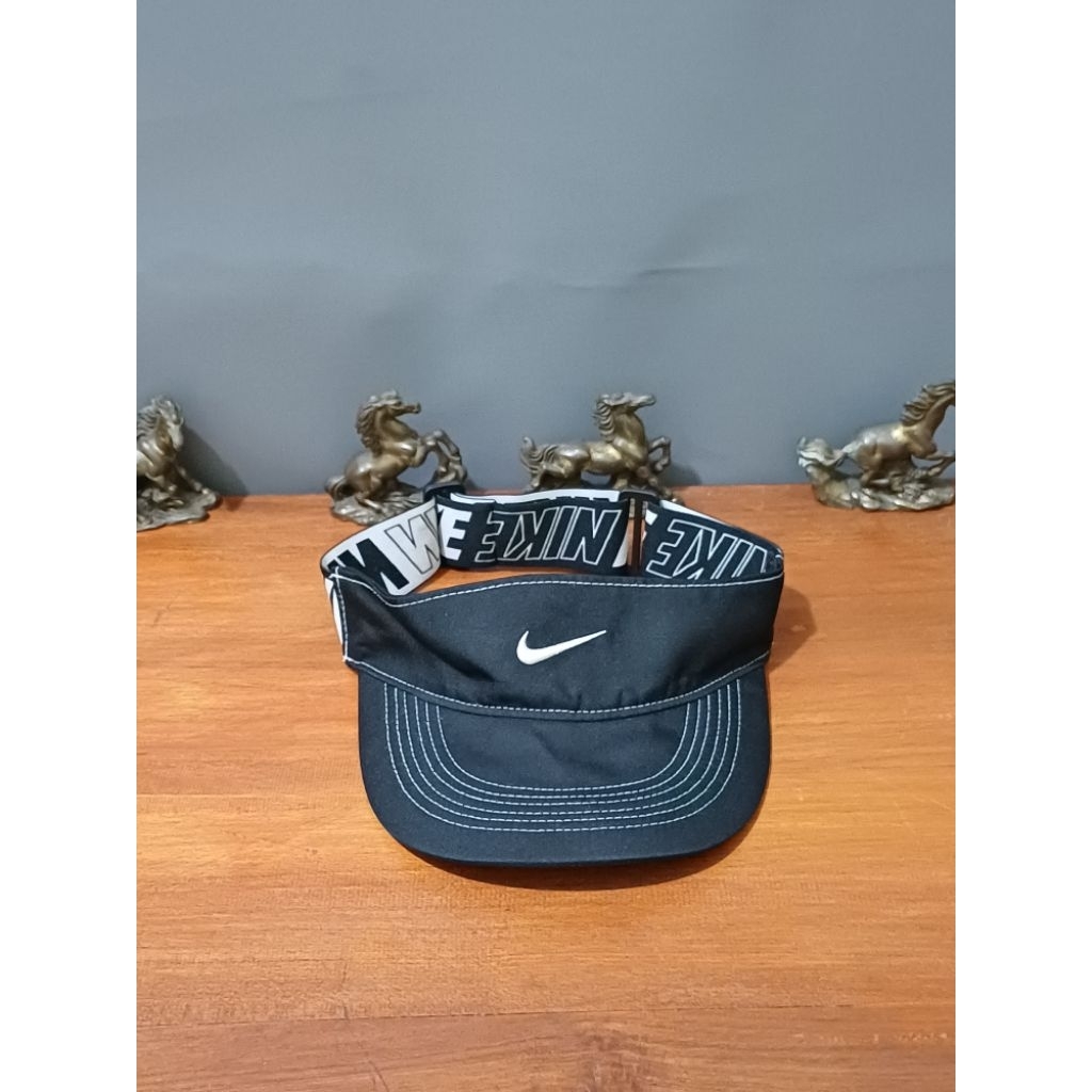 topi running nike second